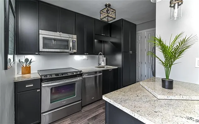 a kitchen with a stove and a microwave