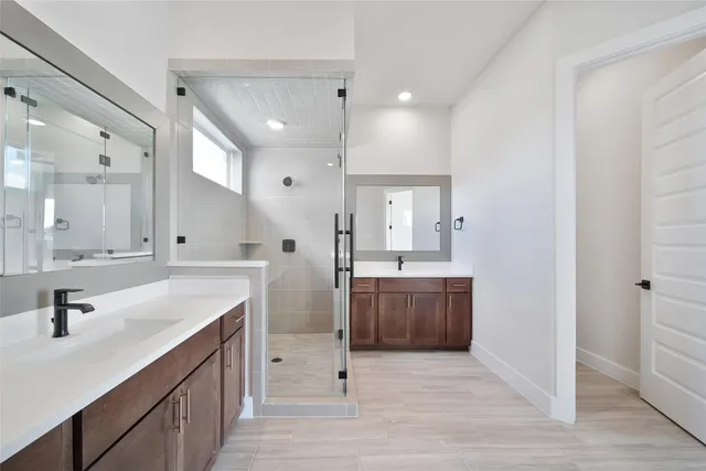 a bathroom with a granite countertop sink mirror and