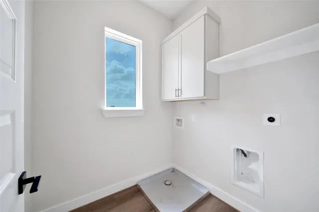 a room with cabinets and window