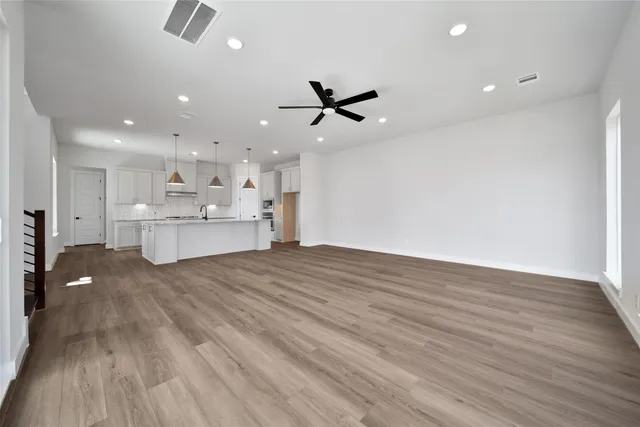 a view of a kitchen with a dishwasher and a stove top oven
