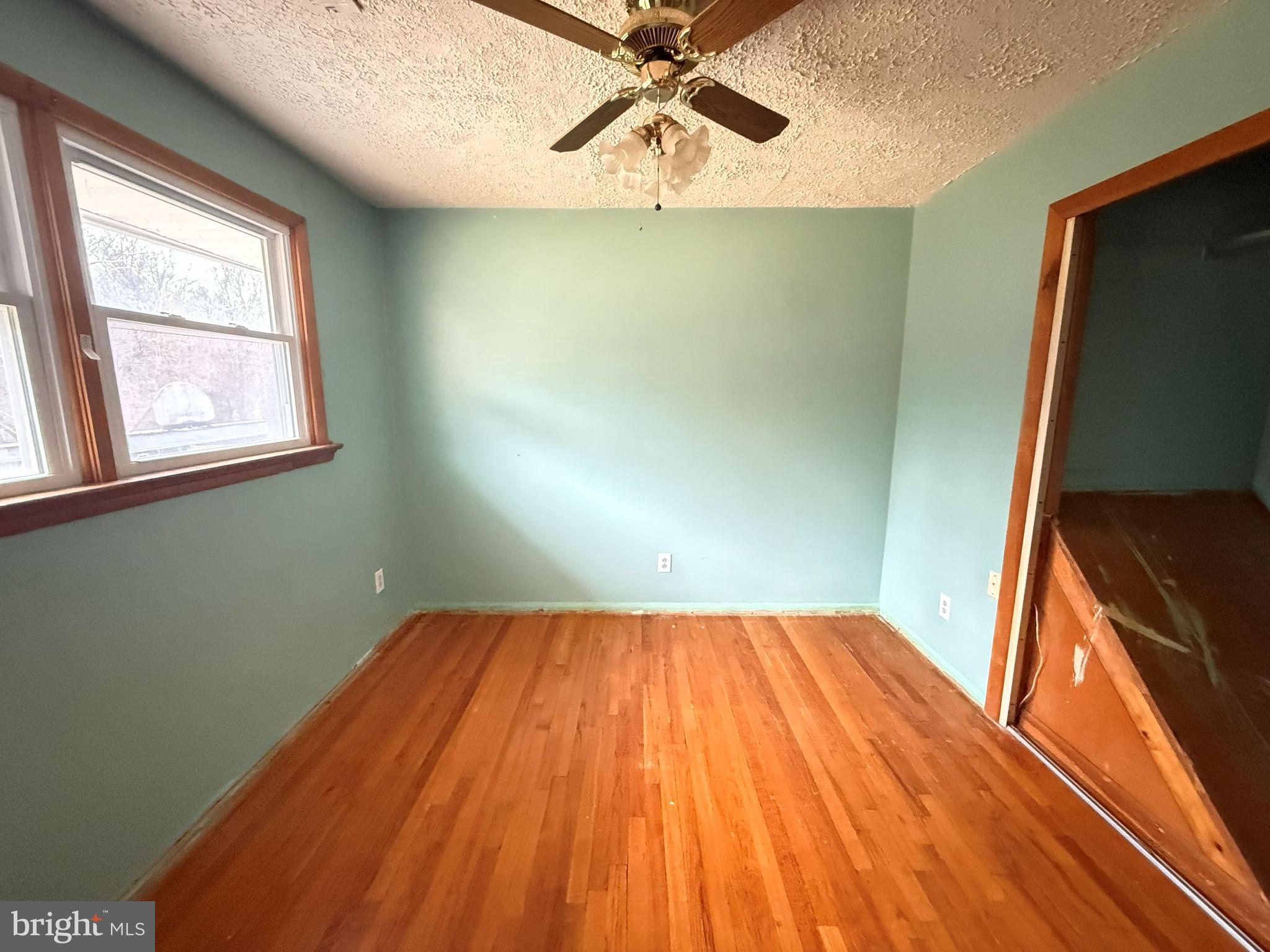 82 Broad Run Road Bentonville, VA 22610 - Photo 12 of 21 a view of a room with wooden floor and fan
