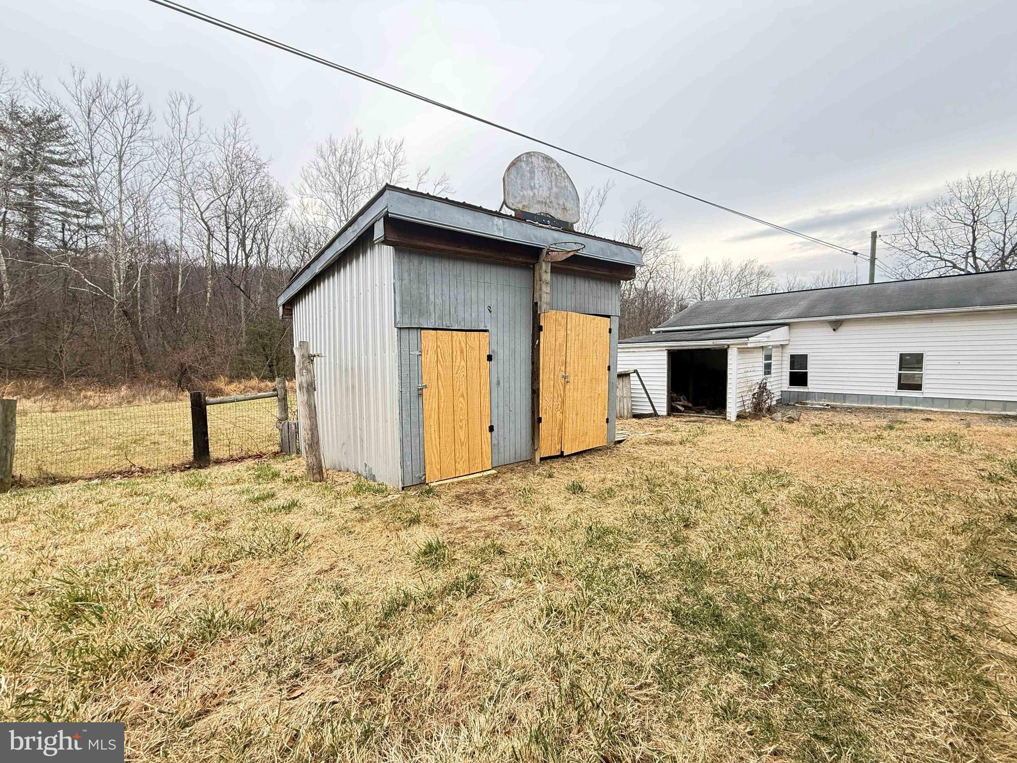 82 Broad Run Road Bentonville, VA 22610 - Photo 19 of 21 a view of a house with a yard