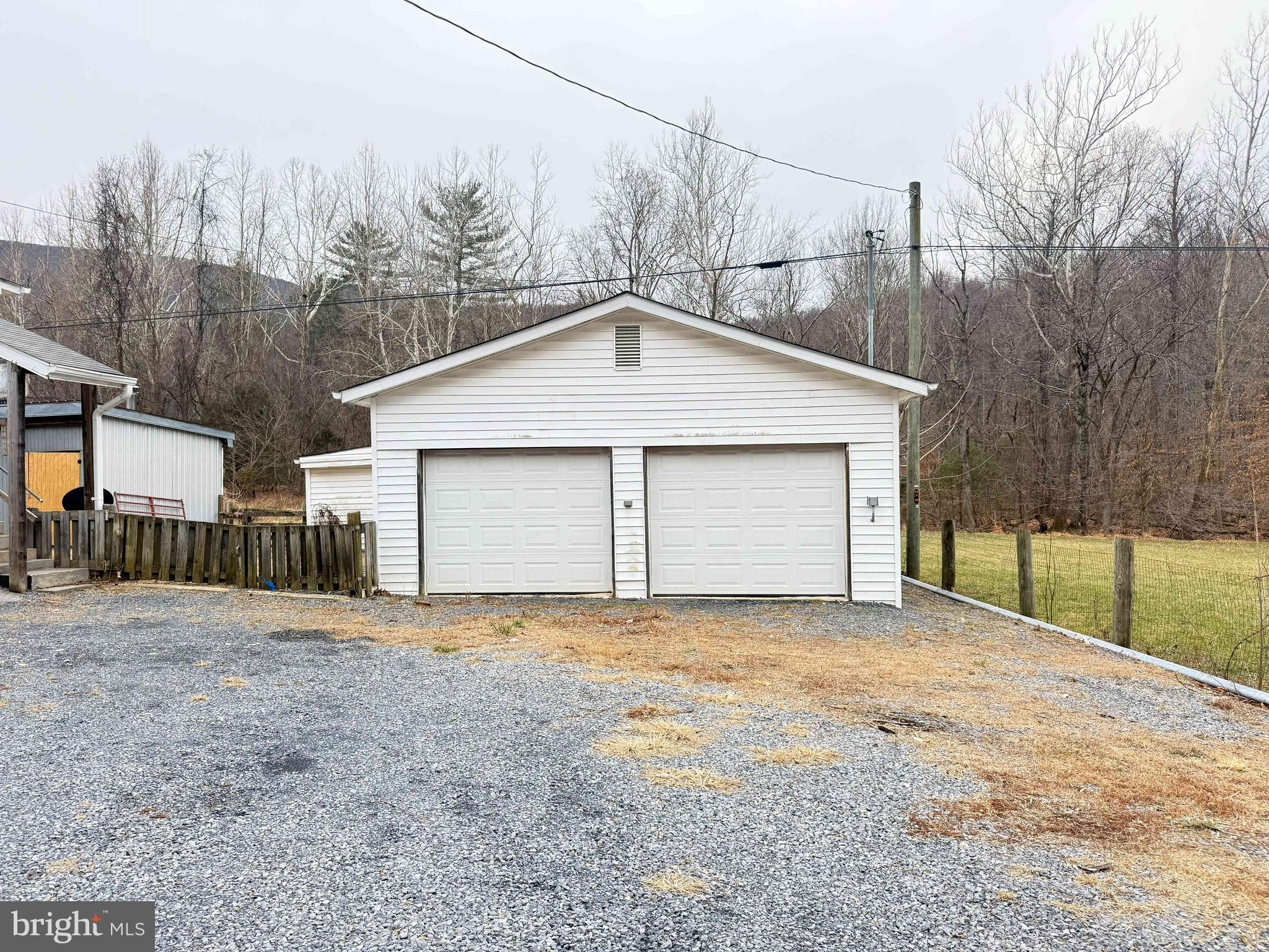 82 Broad Run Road Bentonville, VA 22610 - Photo 21 of 21 a front view of a house with a yard and garage