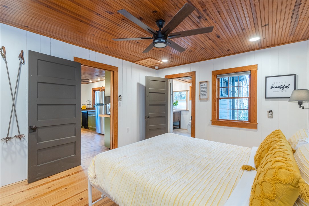 205 Rocky Bottom Road Sunset, SC 29685 - Photo 24 of 46 Warm wood plank ceilings and matching pine floors define this inviting bedroom space.