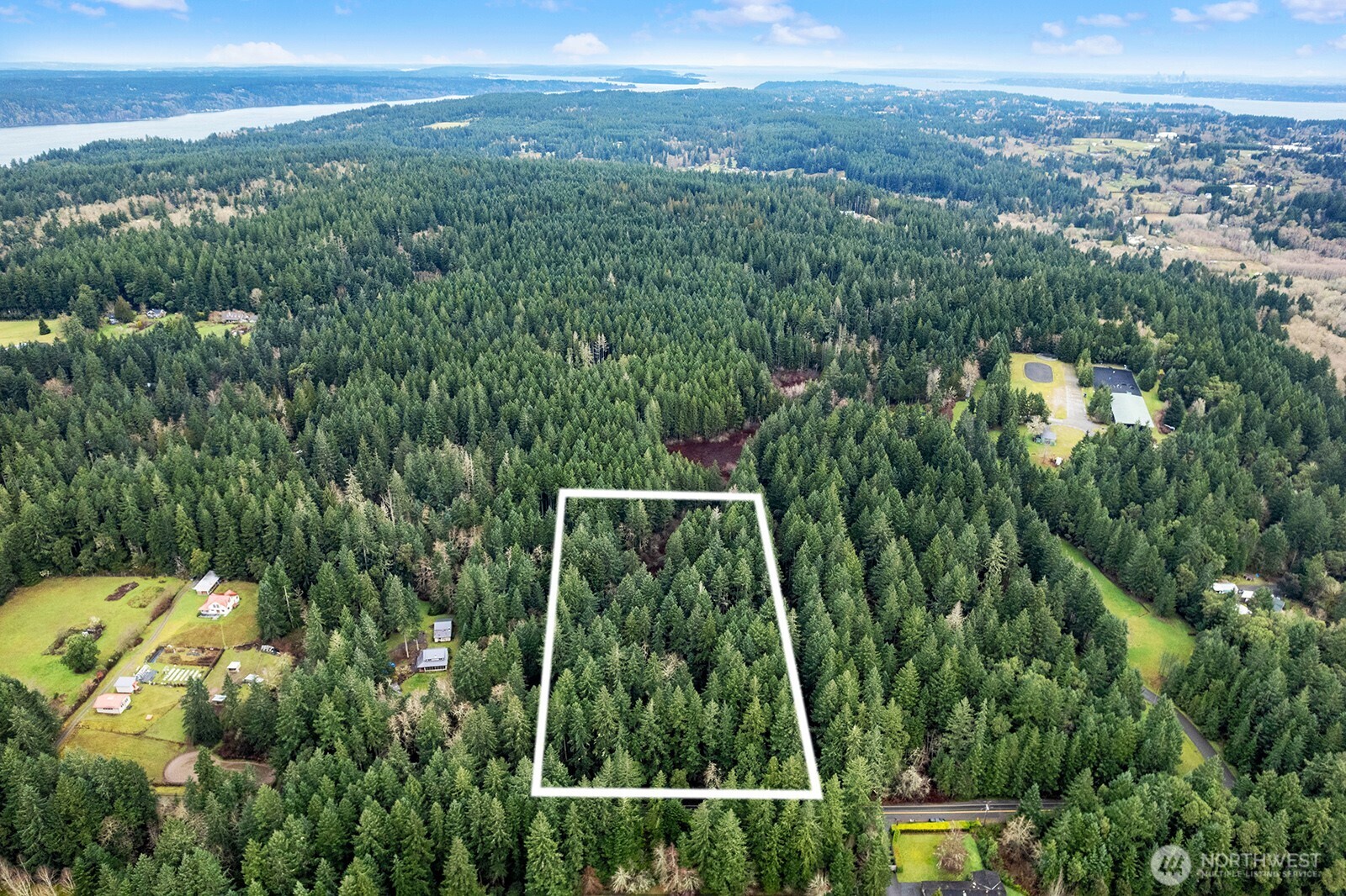 0 Southwest 220th Street Vashon, WA 98070 - Photo 21 of 22 a view of a city with lush green forest