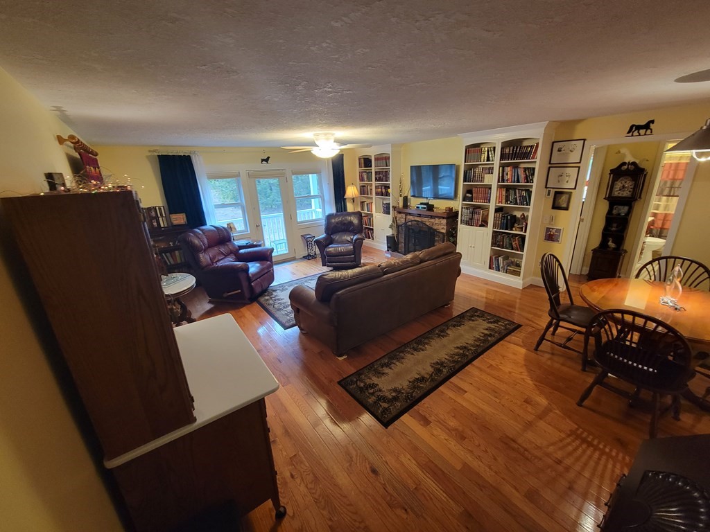 46 Evergreen Road, Unit 210 Leeds, MA 01053 - Photo 11 of 34 a living room with furniture rug and wooden floor