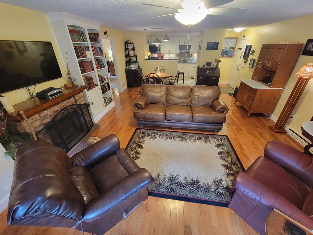 46 Evergreen Road, Unit 210 Leeds, MA 01053 - Photo 13 of 34 a living room with furniture and a flat screen tv