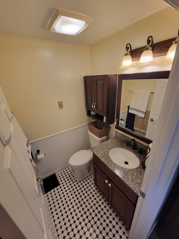 46 Evergreen Road, Unit 210 Leeds, MA 01053 - Photo 30 of 34 a bathroom with a sink toilet and mirror