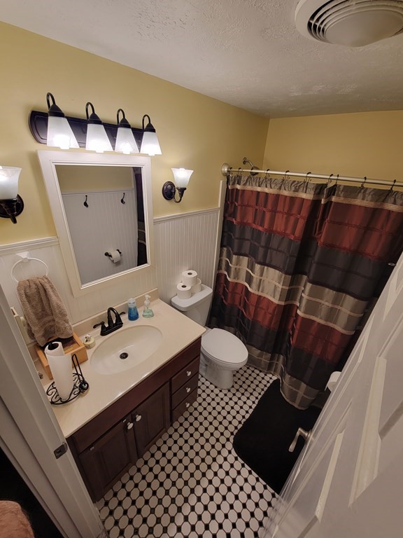 46 Evergreen Road, Unit 210 Leeds, MA 01053 - Photo 31 of 34 a bathroom with a sink toilet and a mirror