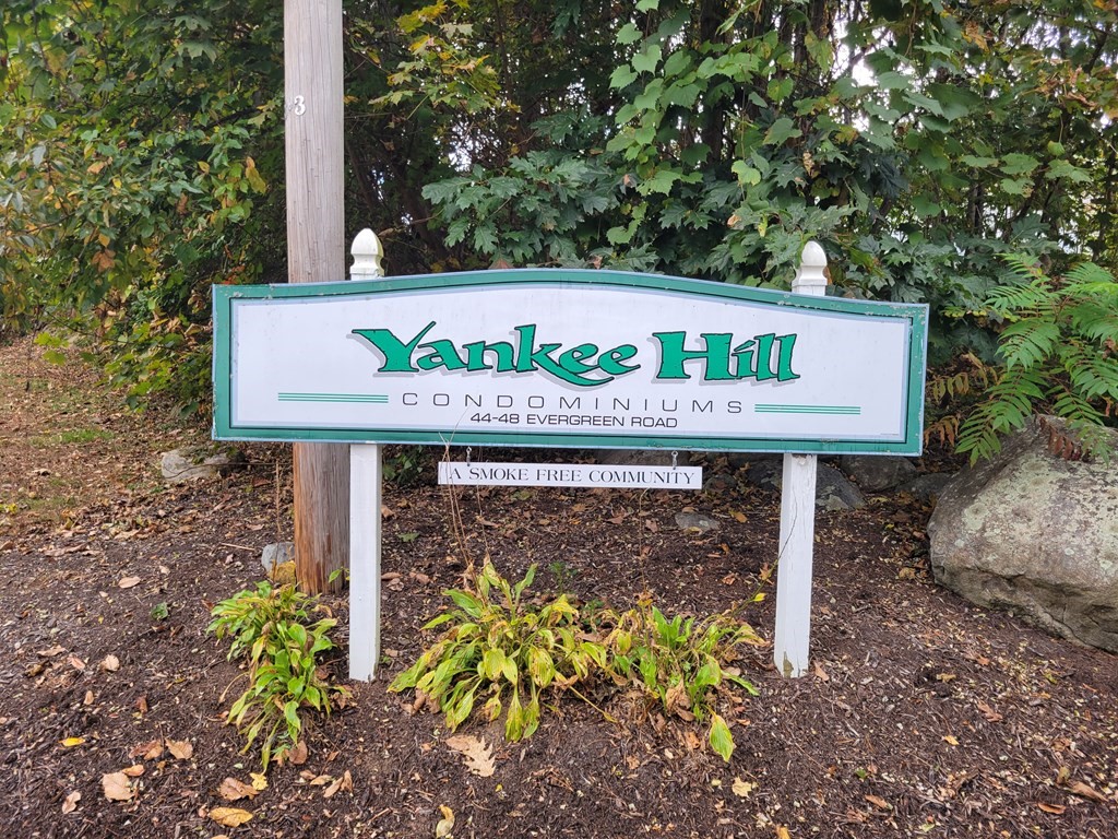 46 Evergreen Road, Unit 210 Leeds, MA 01053 - Photo 34 of 34 a sign on the side of a road