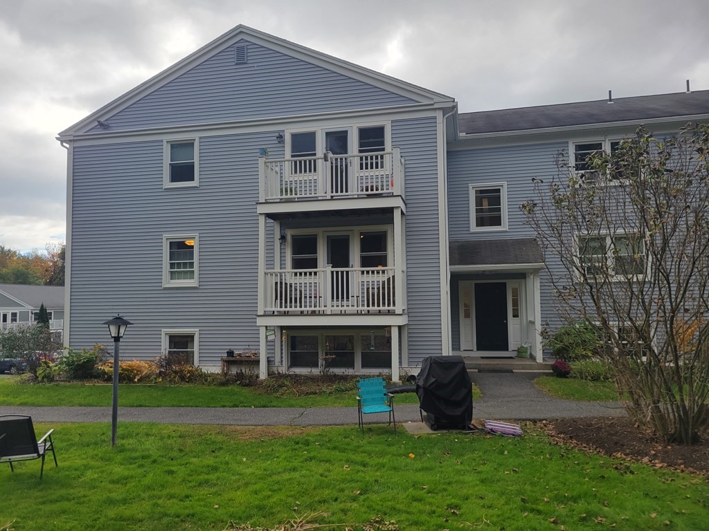 46 Evergreen Road, Unit 210 Leeds, MA 01053 - Photo 4 of 34 a front view of a house with garden