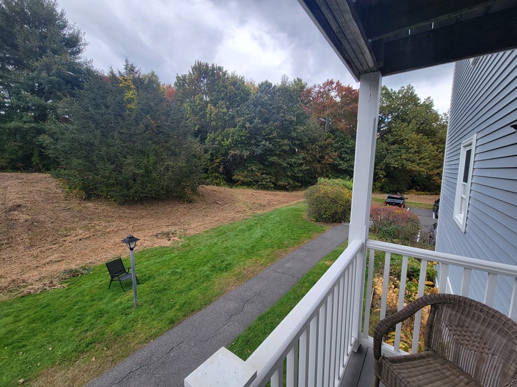 46 Evergreen Road, Unit 210 Leeds, MA 01053 - Photo 8 of 34 a view of a two chair and table in the balcony