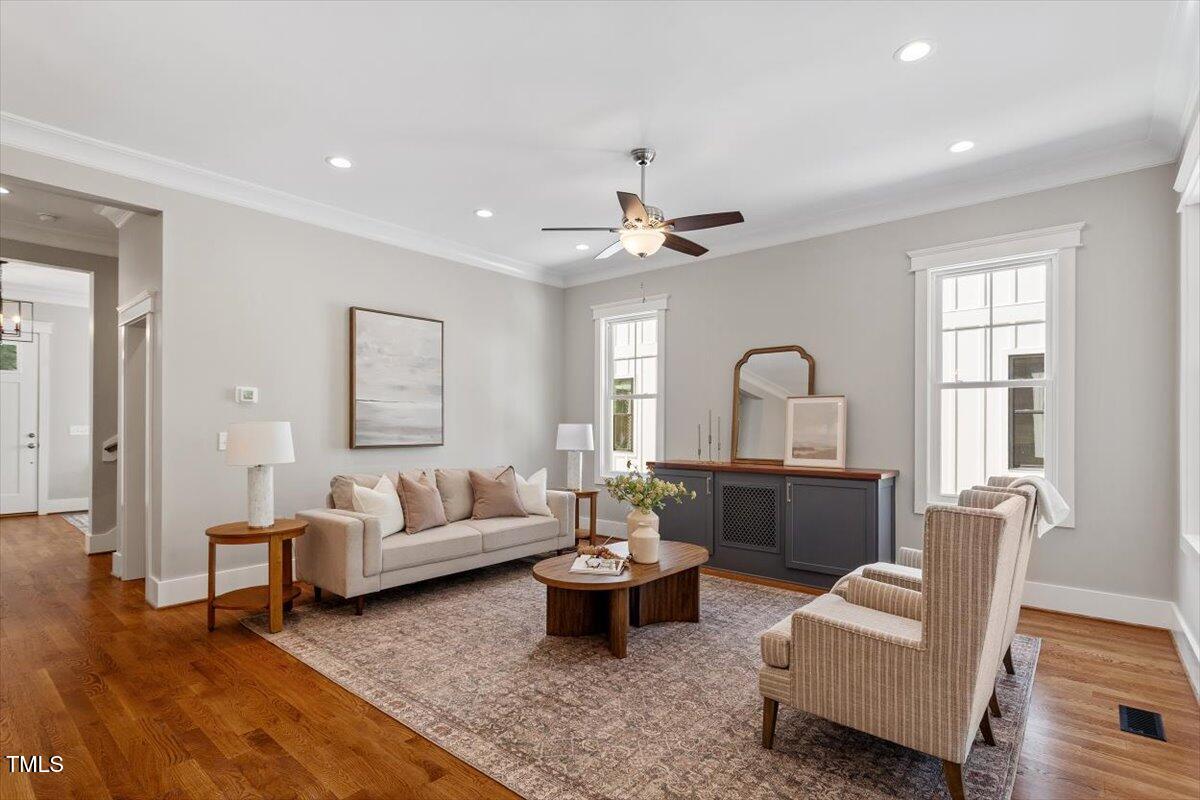 3932 Old Chapel Hill Road Durham, NC 27707 - Photo 22 of 46 a living room with furniture and wooden floor