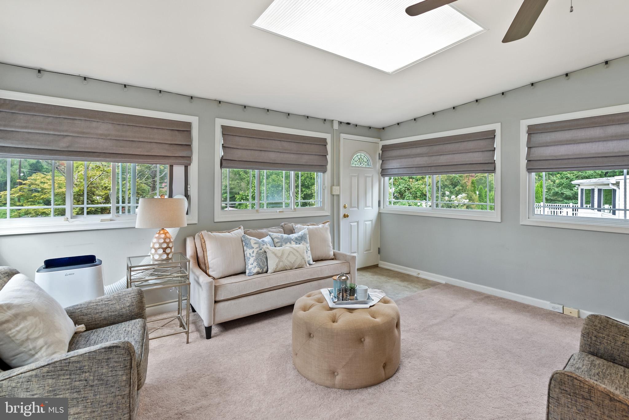 4703 Wyaconda Road Rockville, MD 20852 - Photo 16 of 40 a living room with furniture and a large window