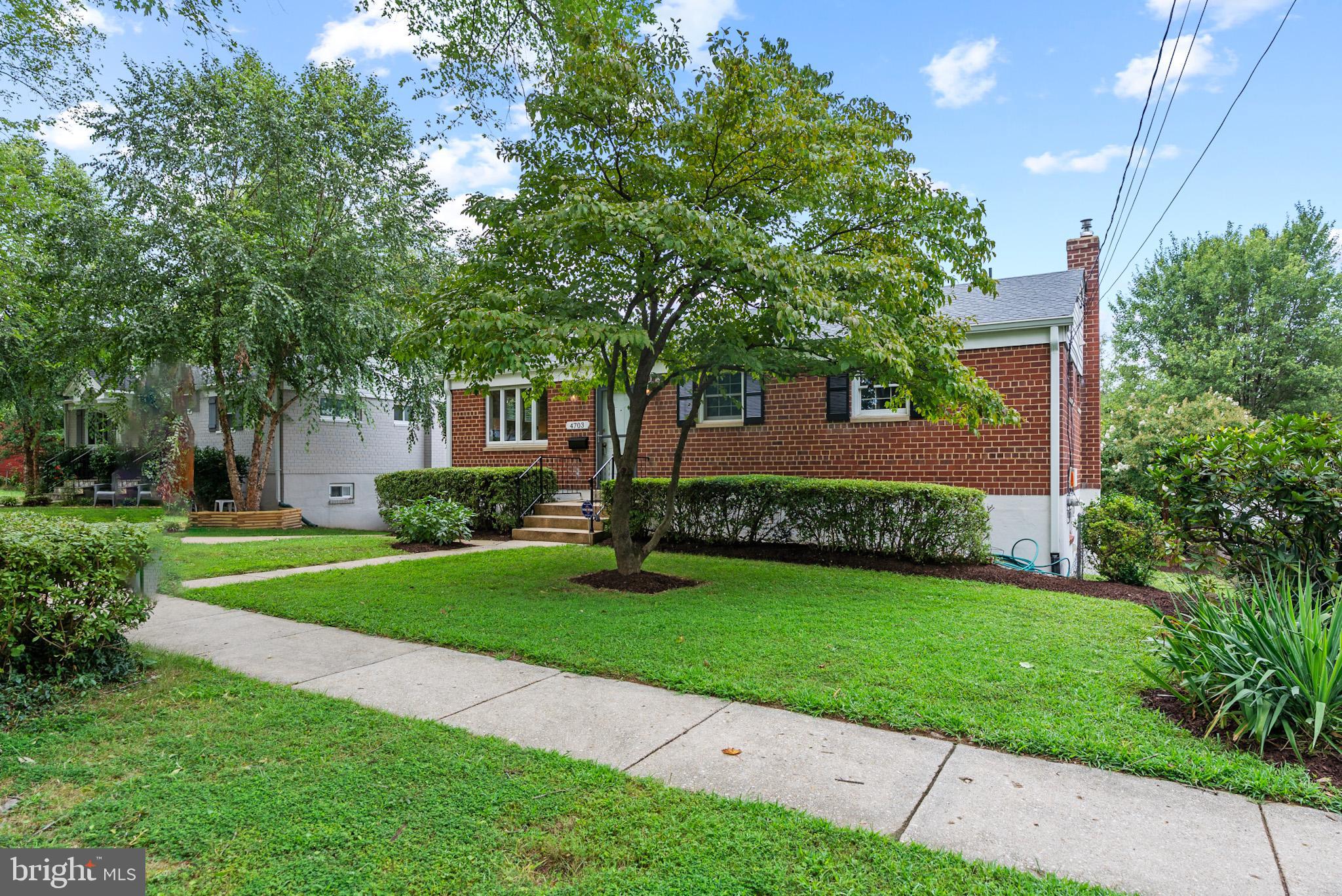 4703 Wyaconda Road Rockville, MD 20852 - Photo 2 of 40 a front view of a house with garden