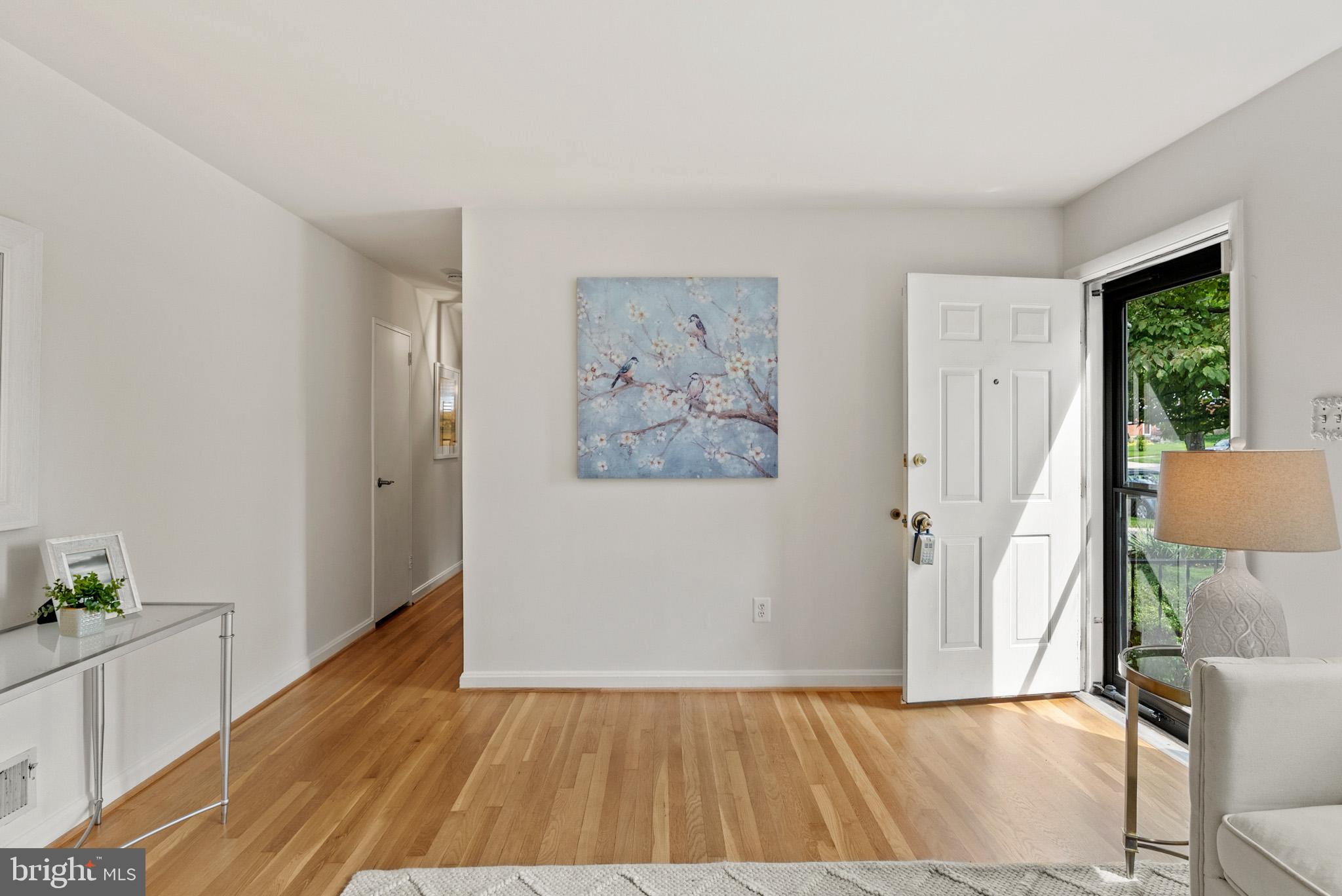 4703 Wyaconda Road Rockville, MD 20852 - Photo 3 of 40 a view of room with window and wooden floor