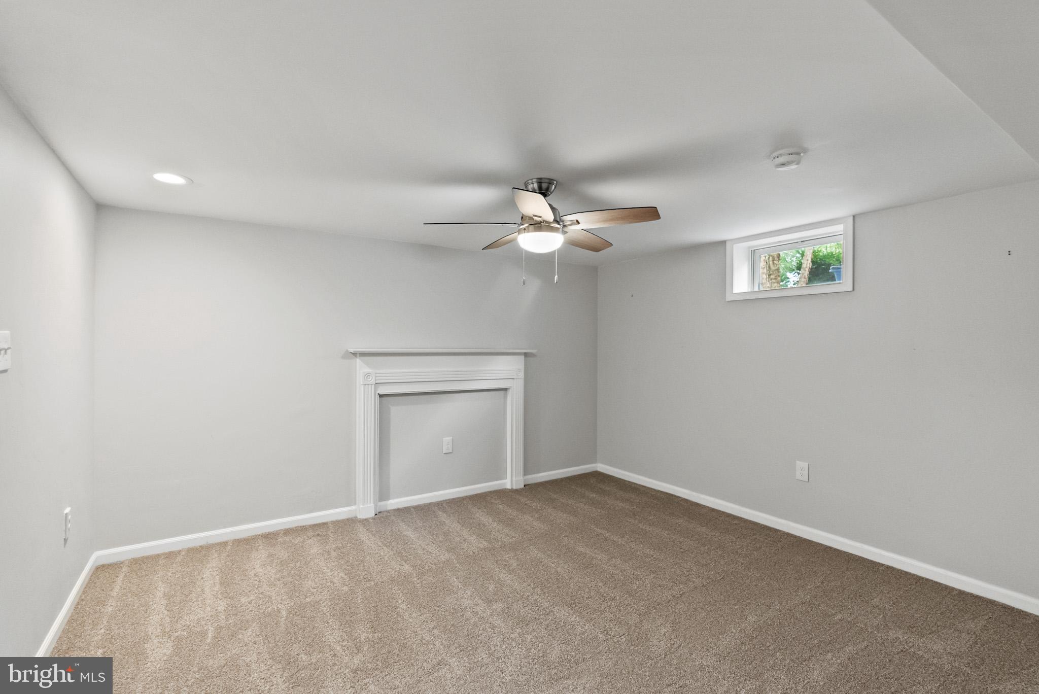 4703 Wyaconda Road Rockville, MD 20852 - Photo 33 of 40 a view of an empty room with a chandelier fan