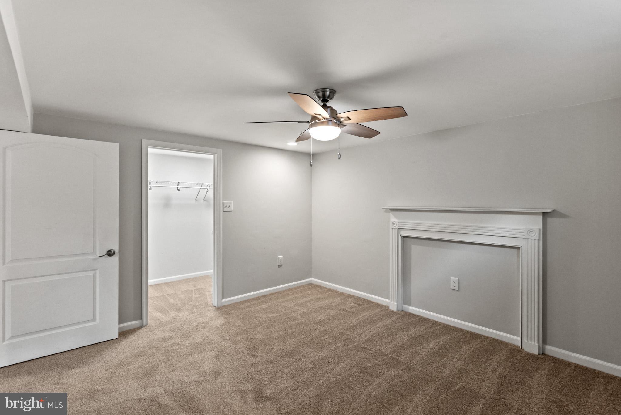 4703 Wyaconda Road Rockville, MD 20852 - Photo 34 of 40 an empty room with closet and a ceiling fan