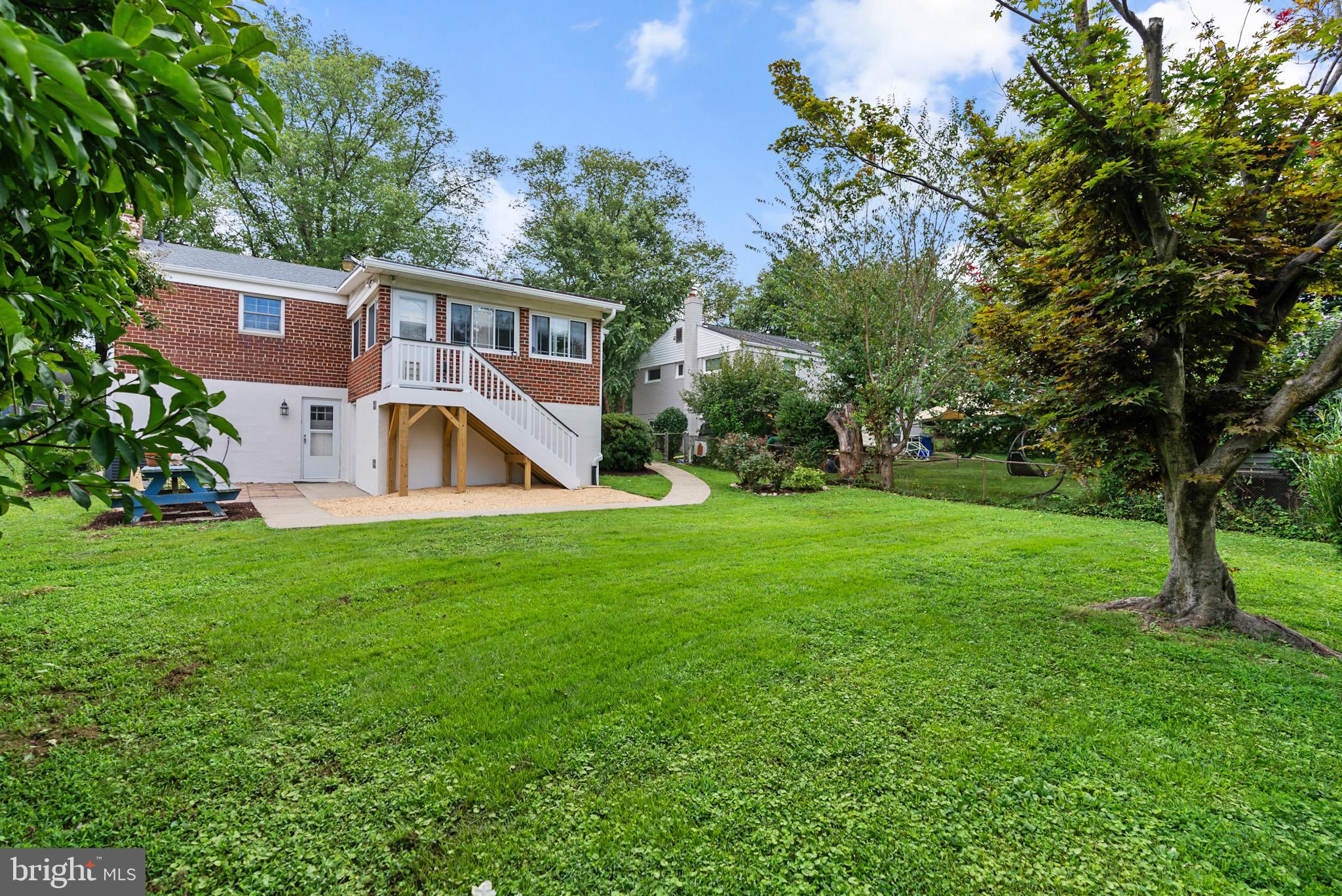 4703 Wyaconda Road Rockville, MD 20852 - Photo 38 of 40 a view of a house with a yard