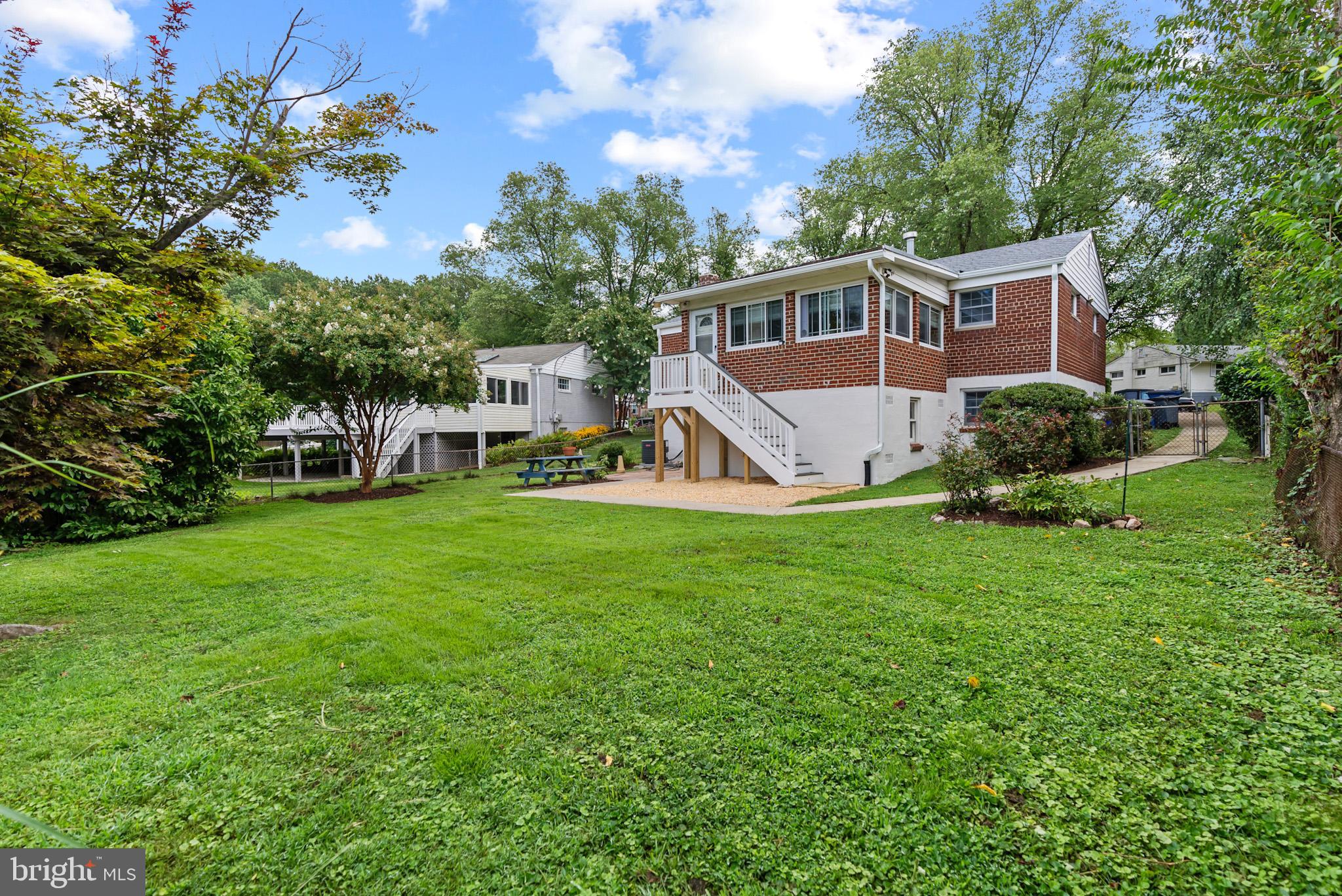 4703 Wyaconda Road Rockville, MD 20852 - Photo 40 of 40 a front view of a house with a yard and green space