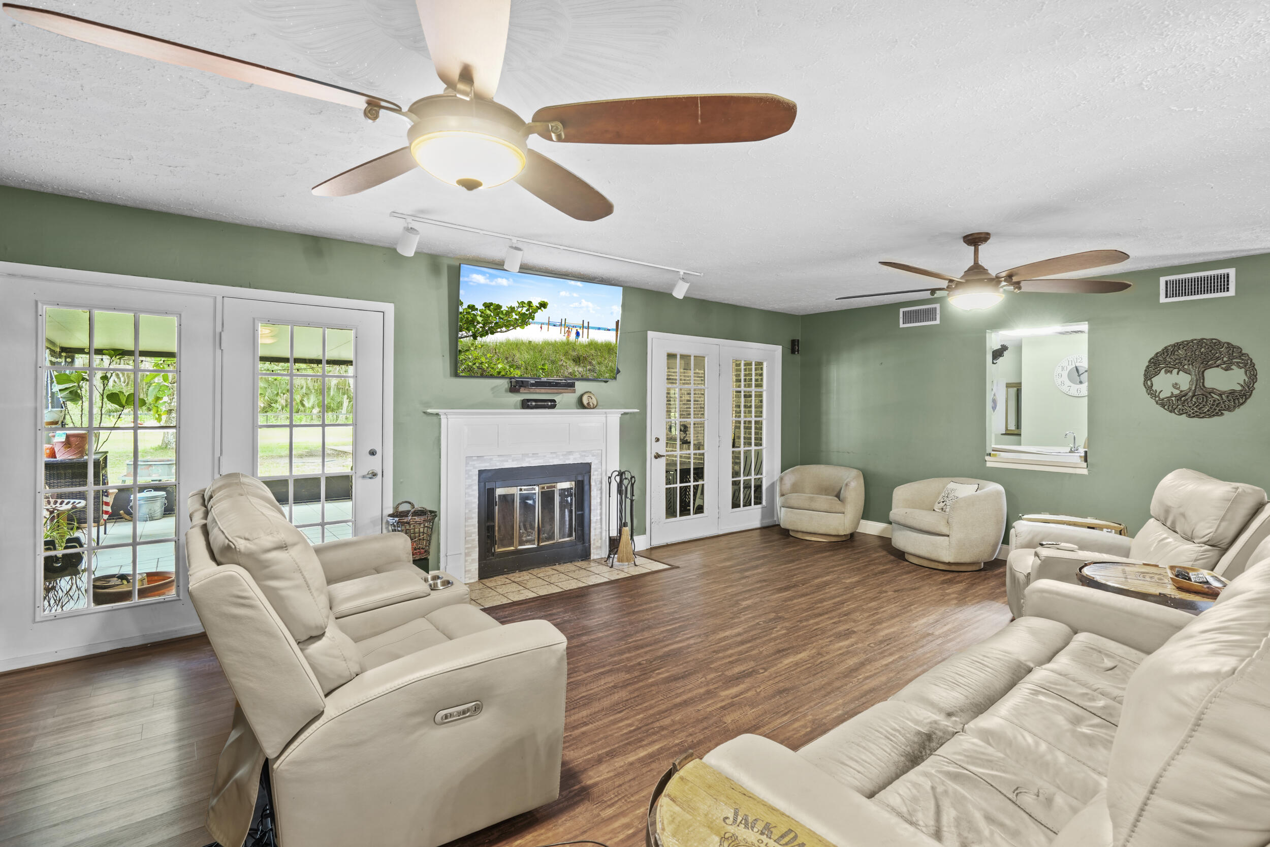 4170 McCarty Road Fort Pierce, FL 34945 - Photo 16 of 57 a living room with furniture and a fireplace