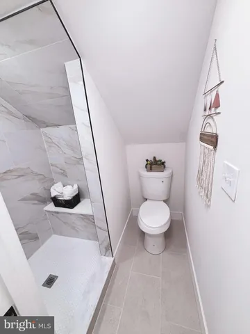 a bathroom with a toilet and a sink