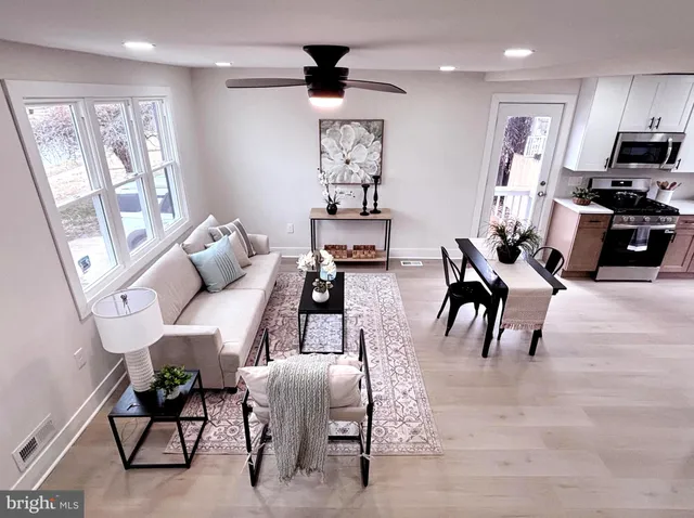 a living room with furniture or outdoor view and a large window