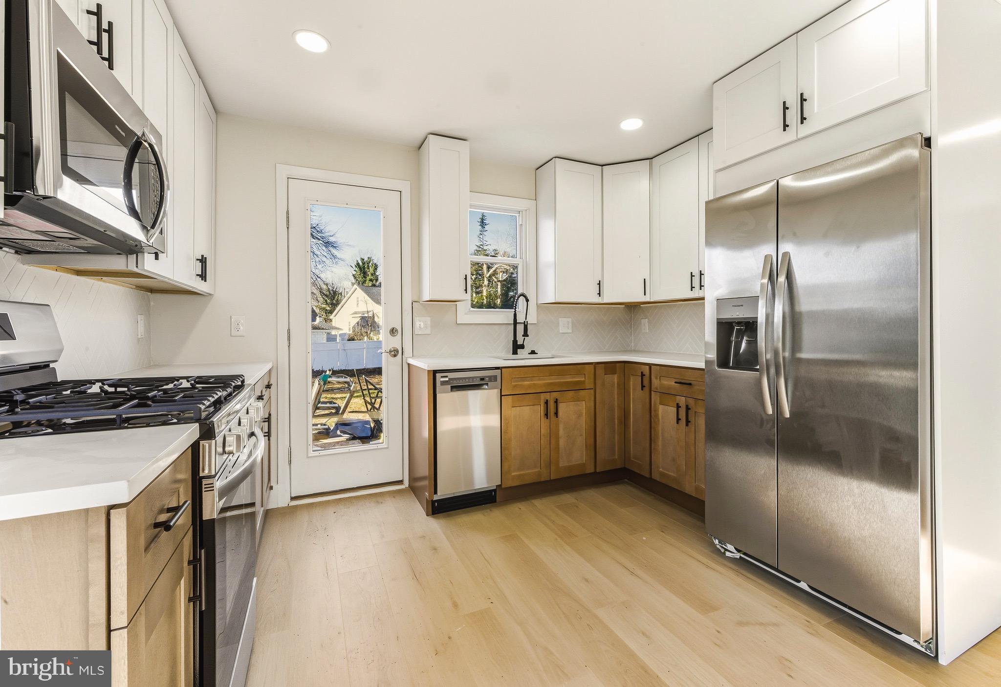 12 Cloverdale Road Blackwood, NJ 08012 - Photo 5 of 17 a kitchen with a sink stove and refrigerator