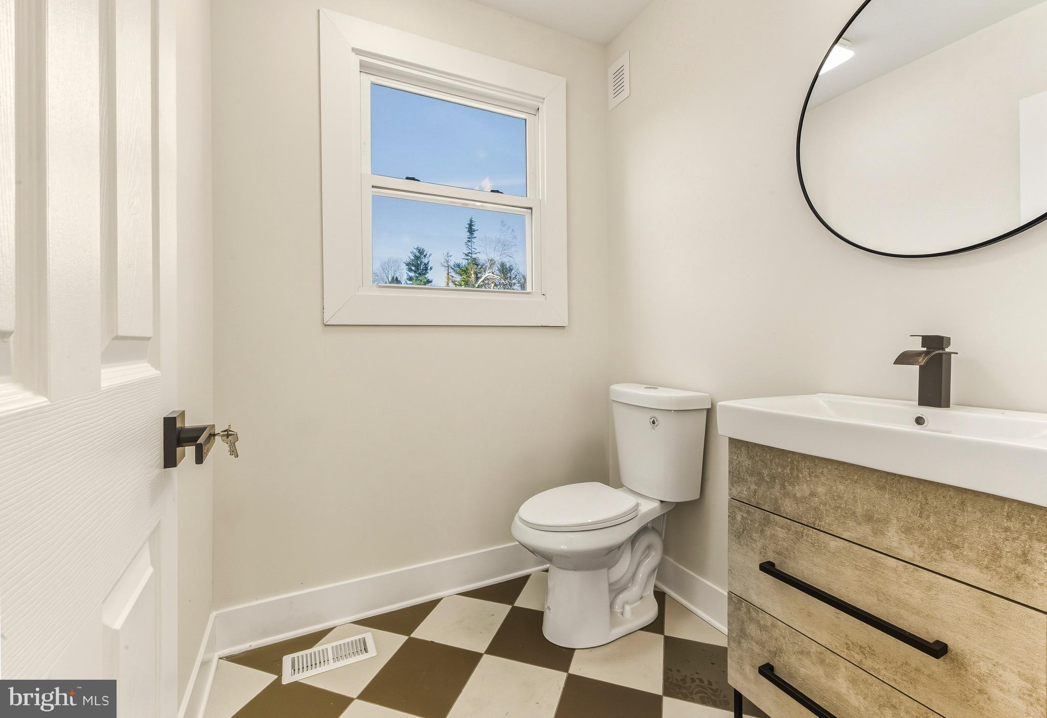 12 Cloverdale Road Blackwood, NJ 08012 - Photo 7 of 17 a bathroom with a sink and a mirror