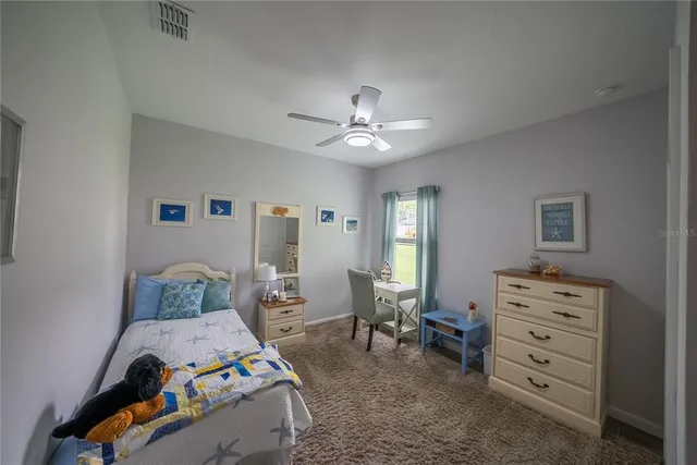 a bedroom with a bed and furniture