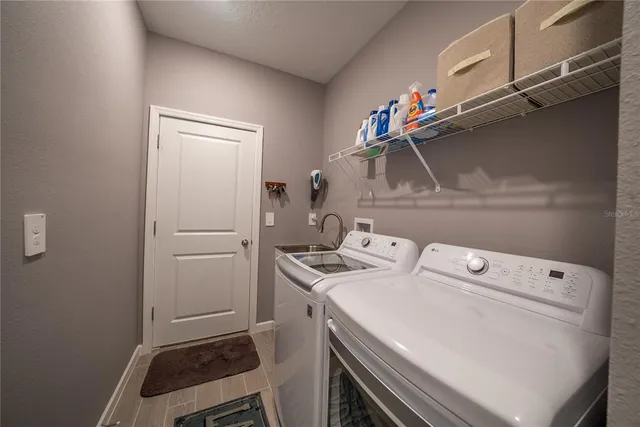 a utility room with dryer and washer