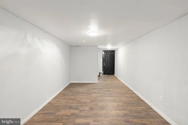 a room that has a dresser and a window in it