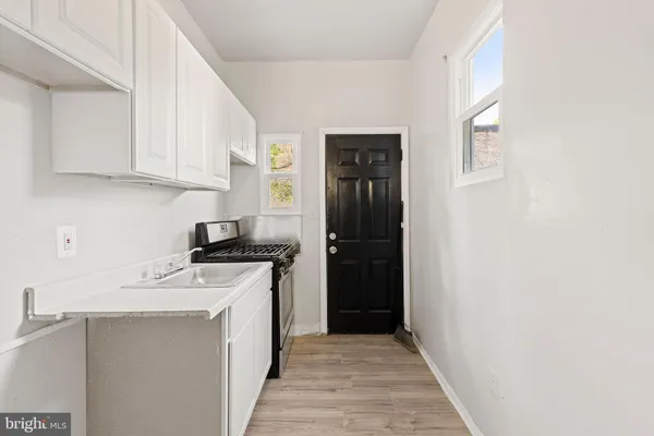 a kitchen with stainless steel appliances granite countertop a stove and a refrigerator