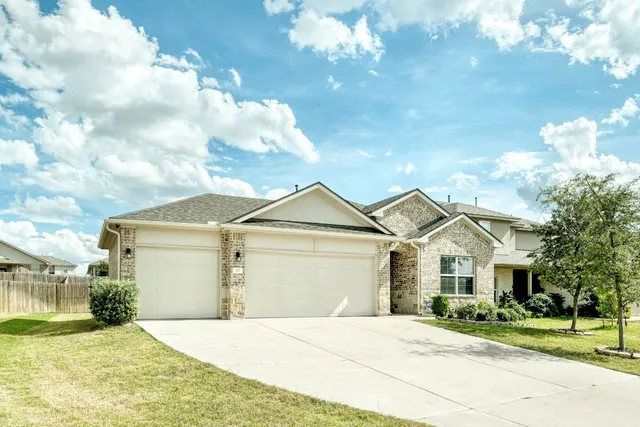 a view of house with yard and entertaining space