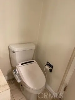 a bathroom with a toilet and a sink