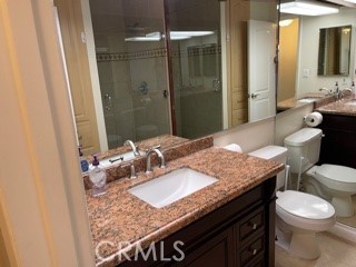 11370 Sunset Boulevard, Unit B Los Angeles, CA 90049 - Photo 12 of 27 a bathroom with a granite countertop sink a toilet and shower