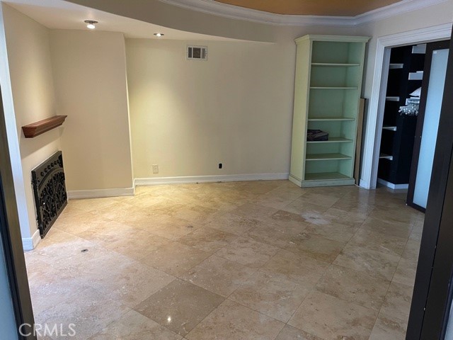 11370 Sunset Boulevard, Unit B Los Angeles, CA 90049 - Photo 15 of 27 a view of an empty room with walk in closet and a fireplace