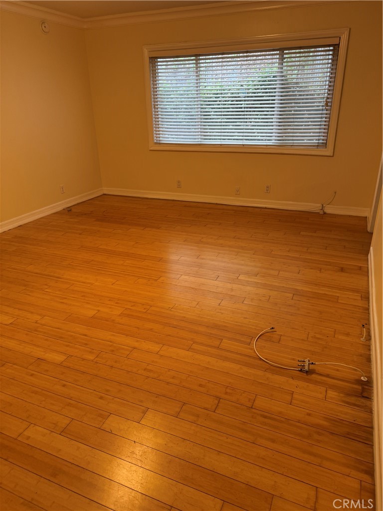 11370 Sunset Boulevard, Unit B Los Angeles, CA 90049 - Photo 18 of 27 a view of a room with wooden floor and window