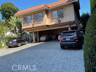 11370 Sunset Boulevard, Unit B Los Angeles, CA 90049 - Photo 27 of 27 a car parked in front of a house