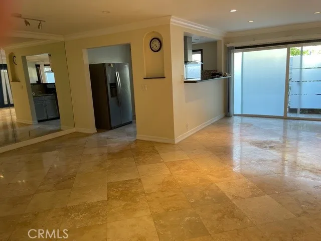 a view of a hallway with wooden shelves