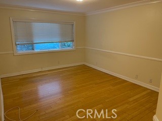11370 Sunset Boulevard, Unit B Los Angeles, CA 90049 - Photo 8 of 27 a view of a room with wooden floor and a window