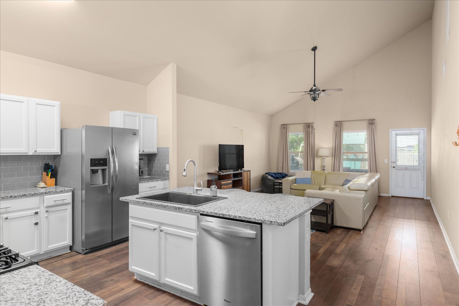 717 Kaluga Trail Leander, TX 78641 - Photo 6 of 40 a kitchen with a center island appliances and cabinets
