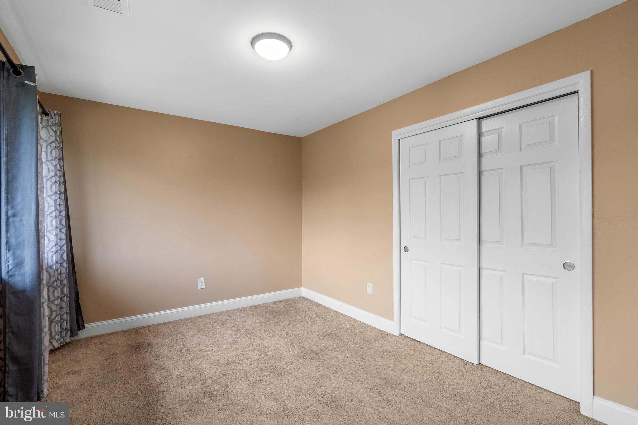 2 Avon Drive Hightstown, NJ 08520 - Photo 12 of 27 an empty room with sliding door