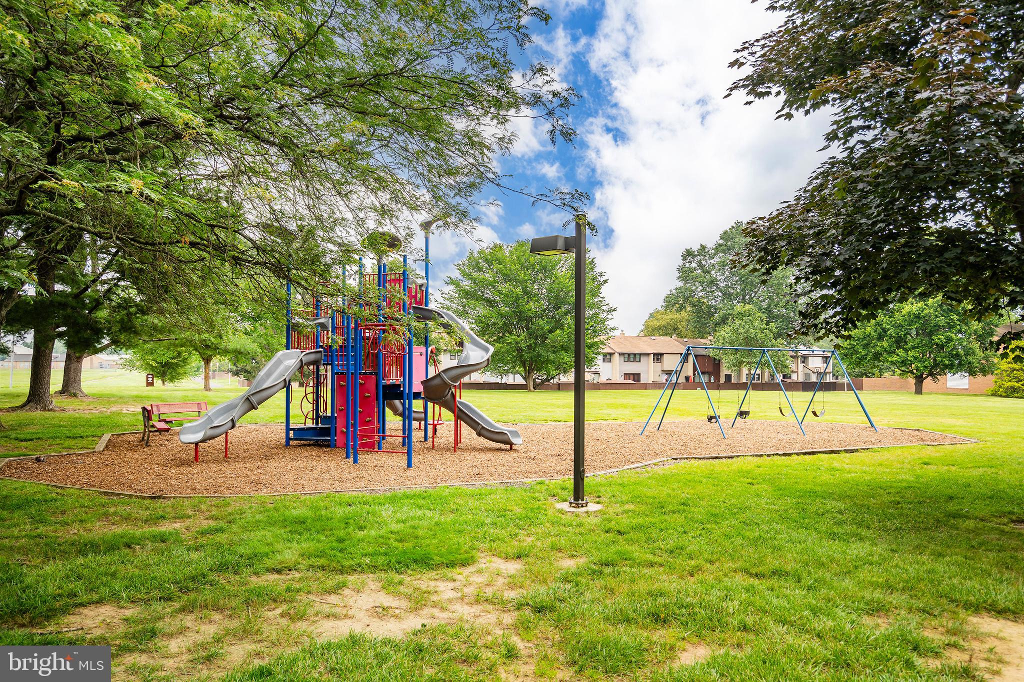 2 Avon Drive Hightstown, NJ 08520 - Photo 16 of 27 a view of a park with swings and slides