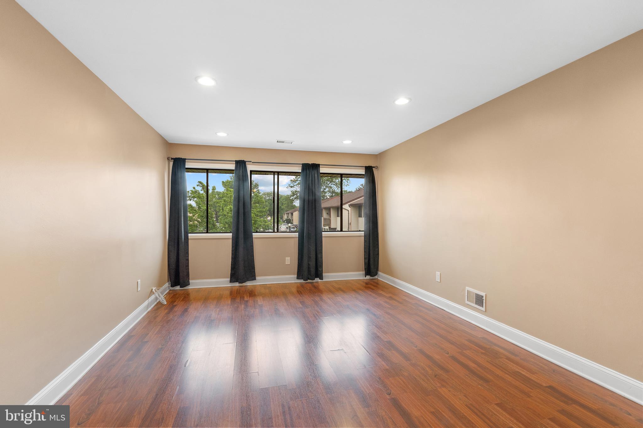 2 Avon Drive Hightstown, NJ 08520 - Photo 2 of 27 wooden floor in an empty room with a window