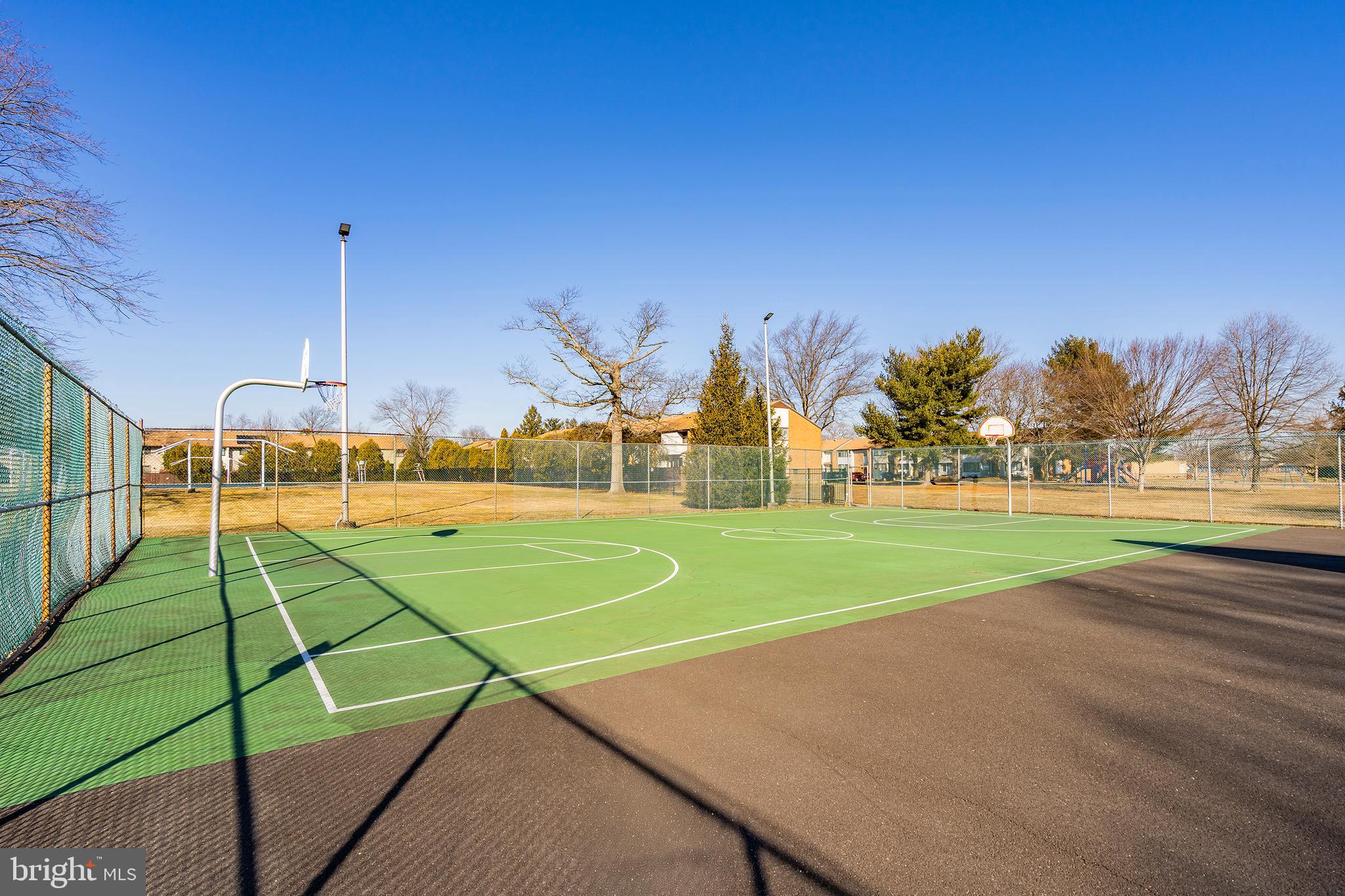 2 Avon Drive Hightstown, NJ 08520 - Photo 21 of 27 a view of a tennis ground with large trees