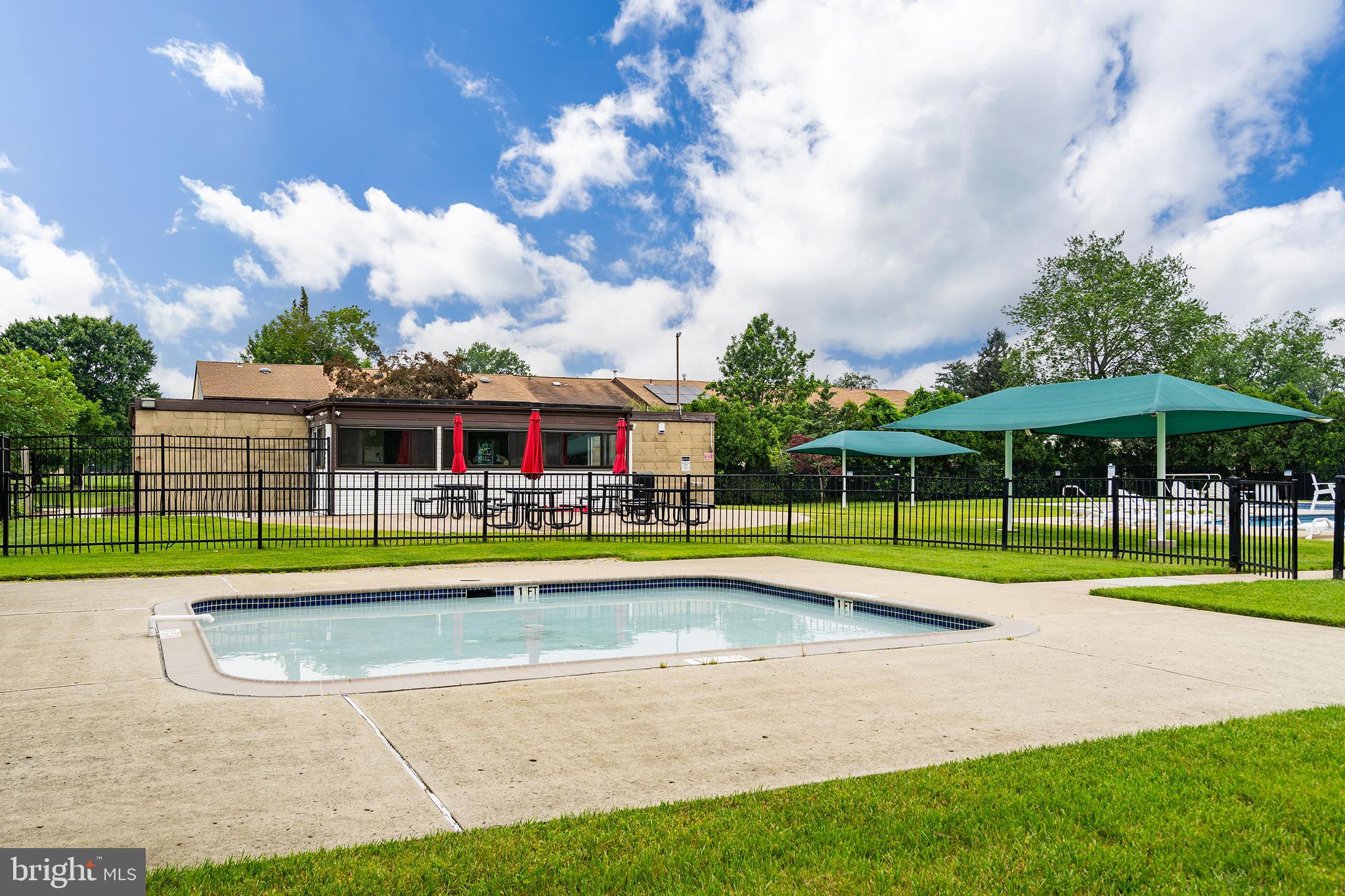 2 Avon Drive Hightstown, NJ 08520 - Photo 26 of 27 a view of pool with umbrella and trees in the background