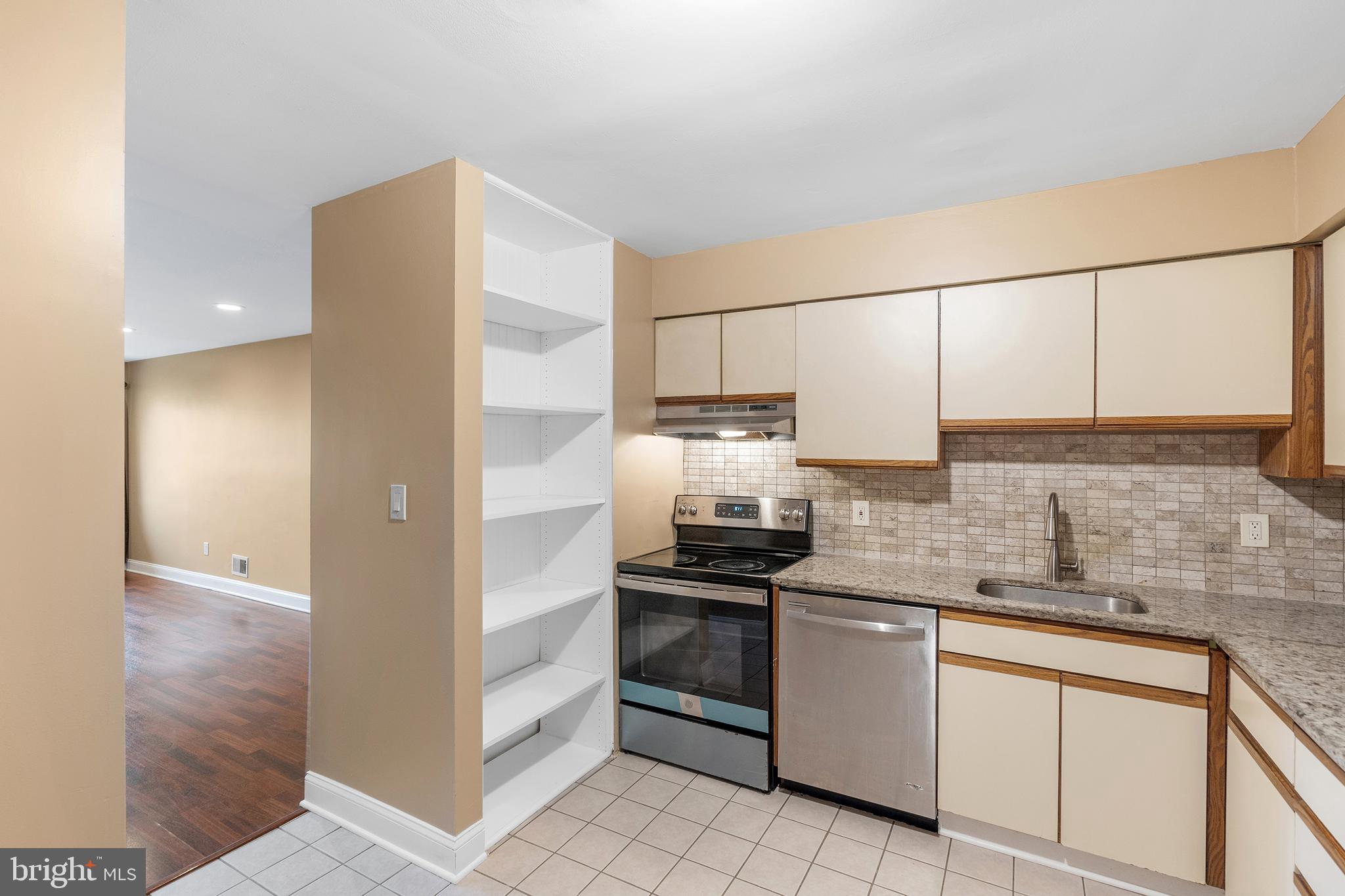 2 Avon Drive Hightstown, NJ 08520 - Photo 5 of 27 a kitchen with stainless steel appliances a sink stove and refrigerator