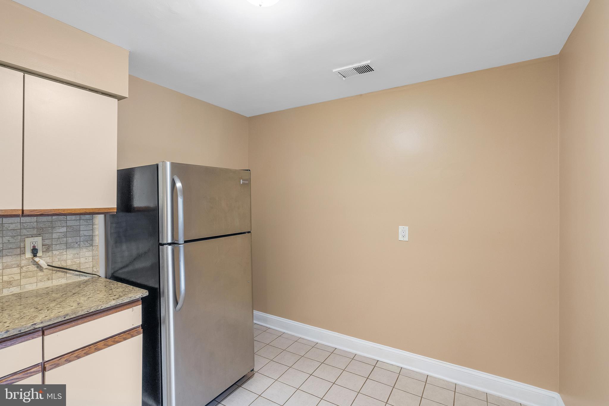 2 Avon Drive Hightstown, NJ 08520 - Photo 6 of 27 a kitchen with a refrigerator and a sink