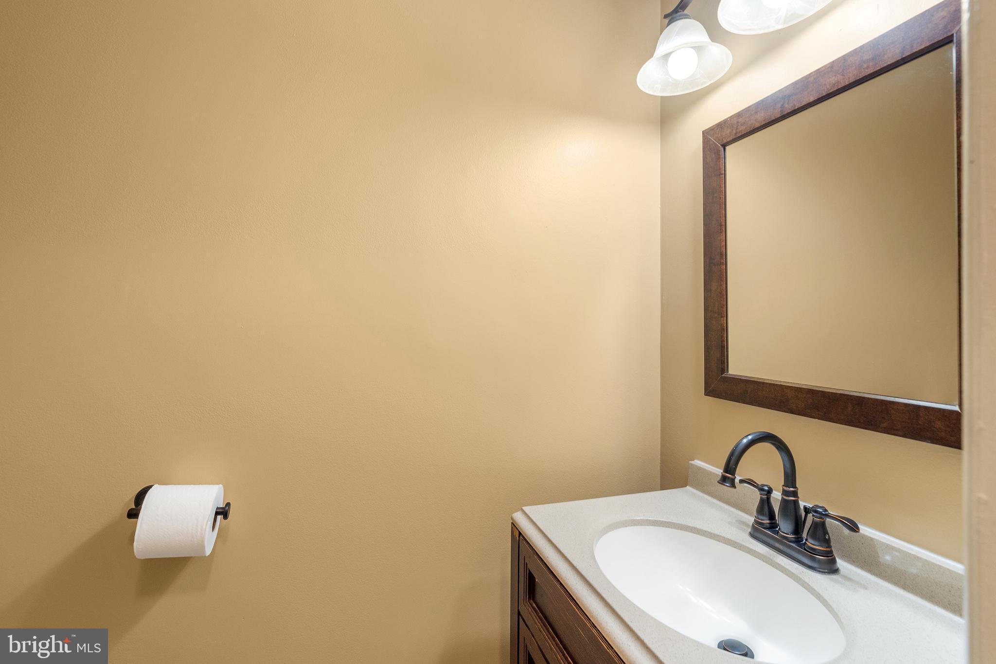 2 Avon Drive Hightstown, NJ 08520 - Photo 7 of 27 a bathroom with a sink a mirror and vanity